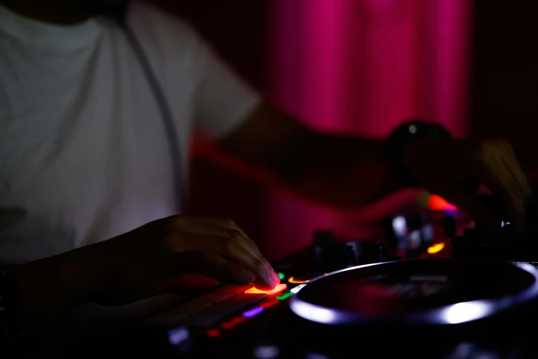 a man operating the mixer on a turntable