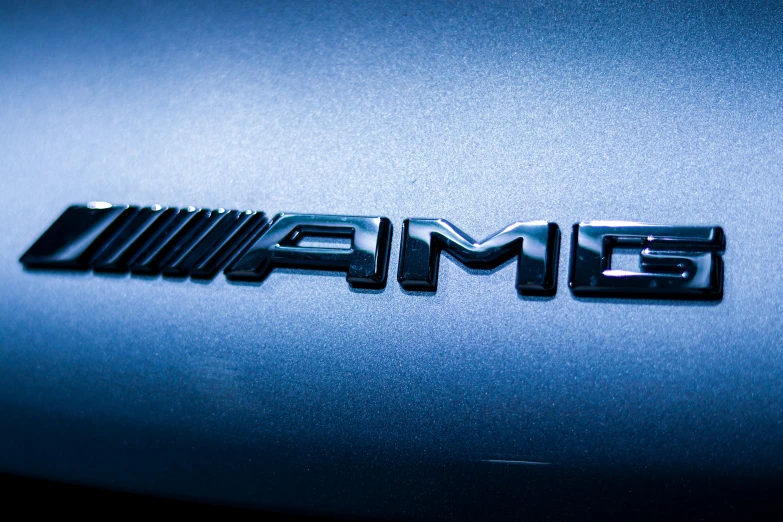 a grille or emblem with the name amg on it