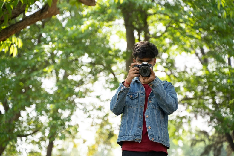 a person standing in a park taking a po