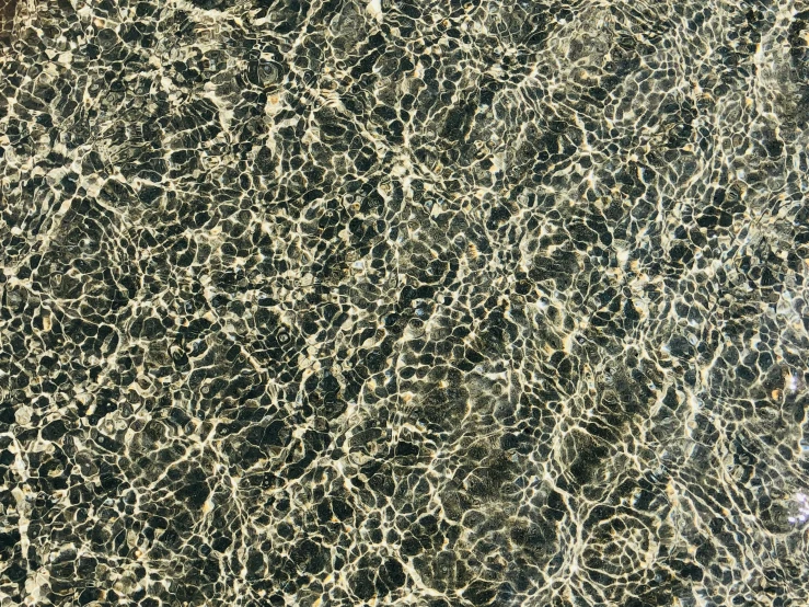 water is flowing over a marble slab of cement