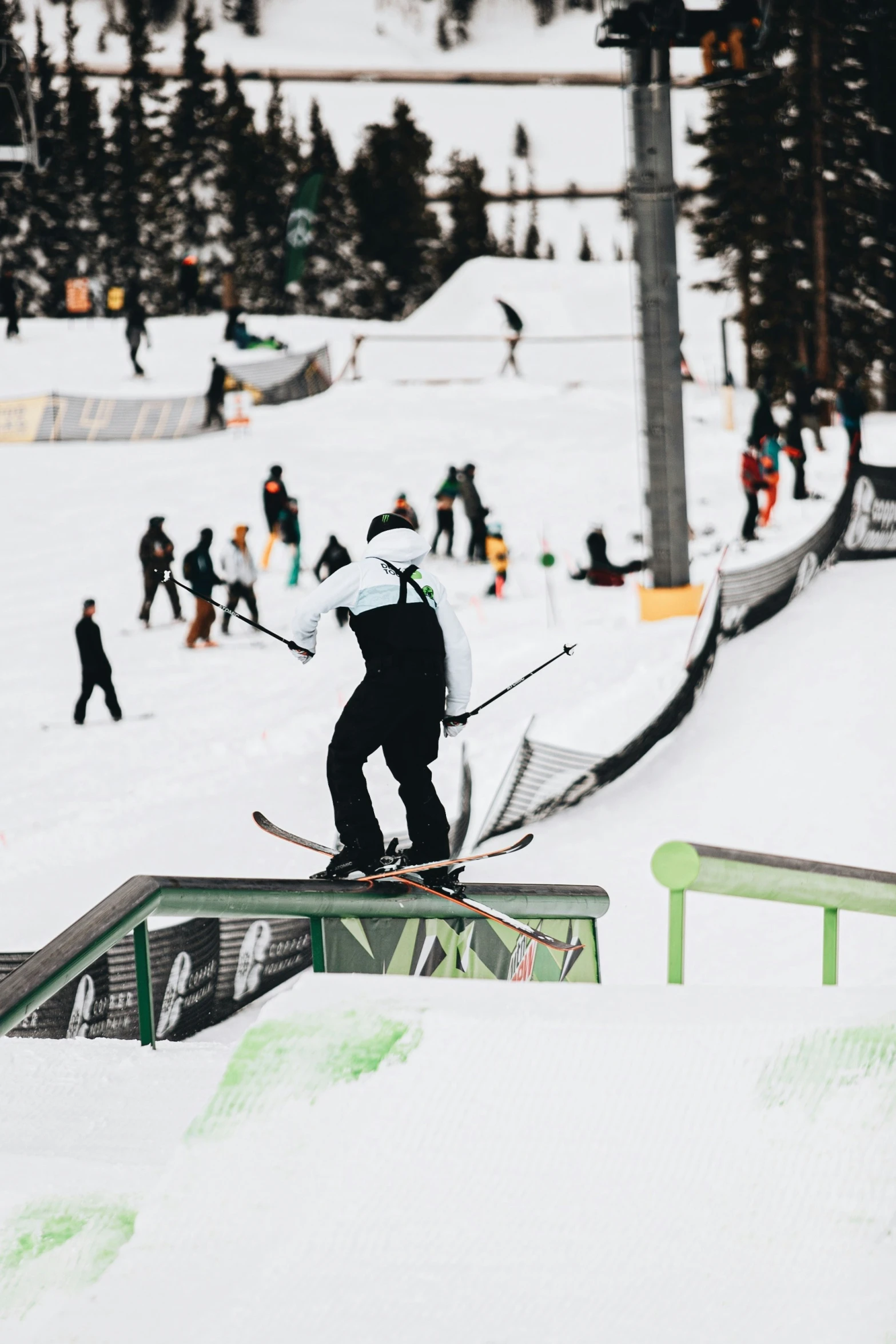 a man on skis coming down a ramp