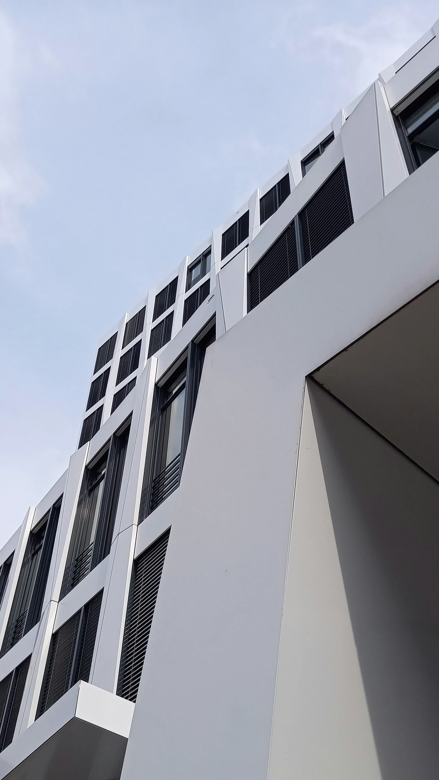 the front of a building with multiple windows on it