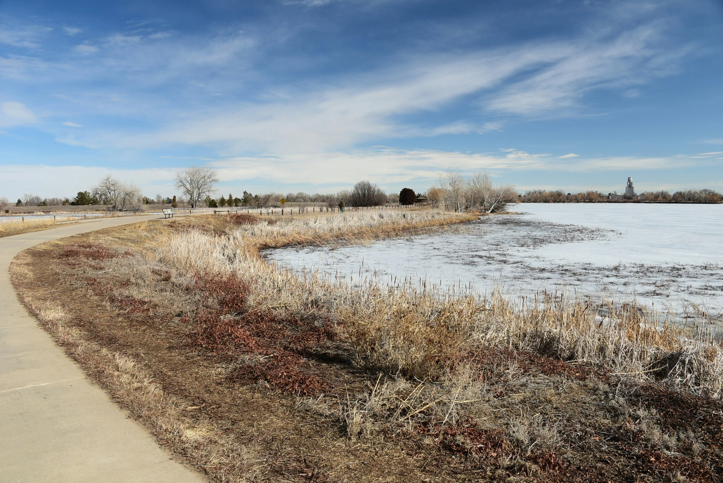 a couple of roads going through a frozen lake