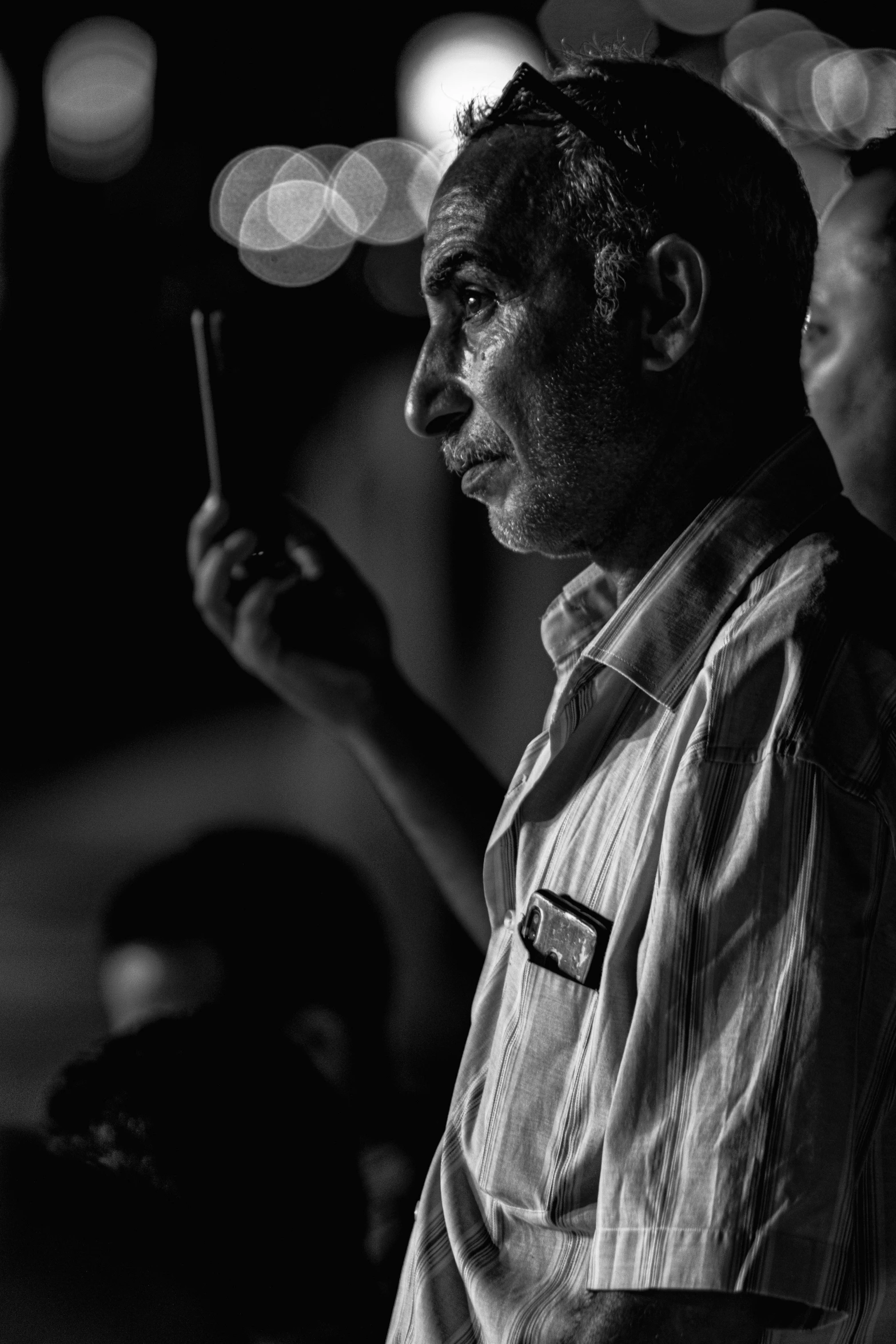 black and white image of man smoking a pipe