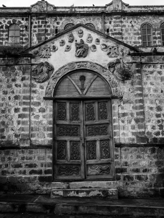 a building with a very big wooden door