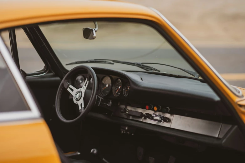 interior of a car with an old style steering wheel