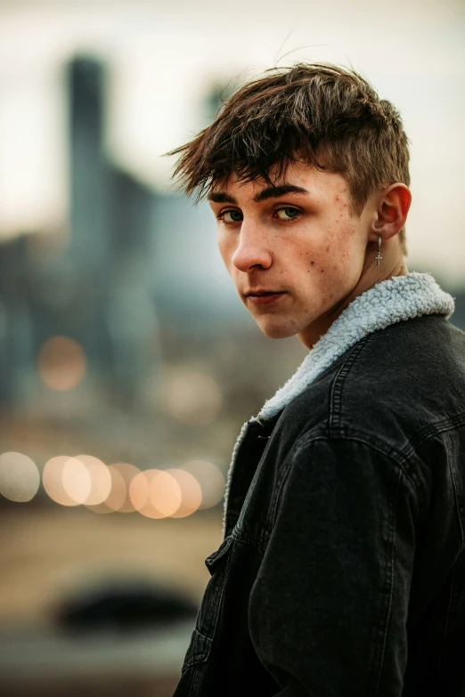 young man looking at camera on a street