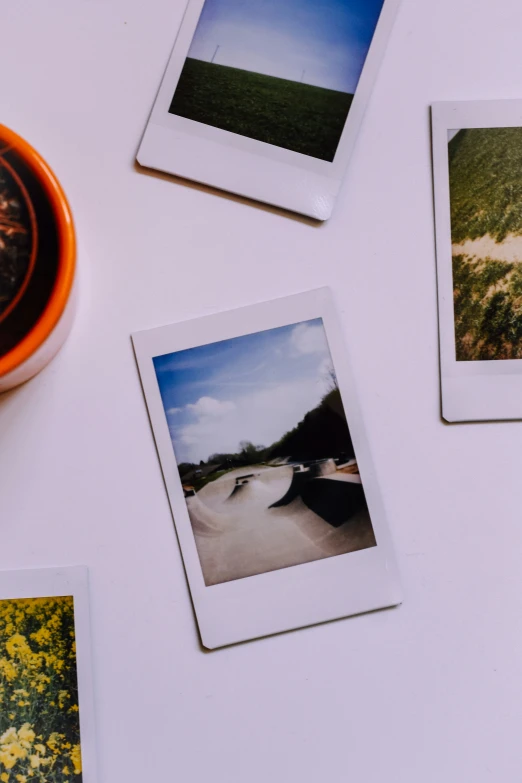 three polaroid style pictures hang from the wall