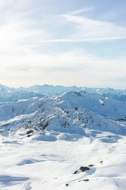 a snowy mountain in the distance is covered in white snow