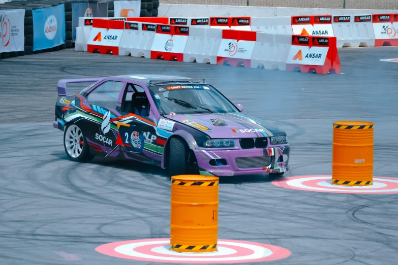 a race car making a turn at a track