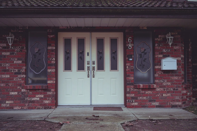 the two doors have decorative designs on them