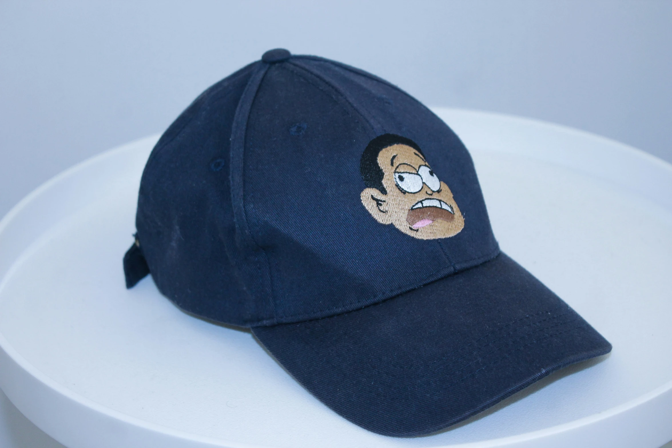 a hat with the face of homer simpson emblazoned on it