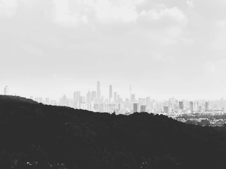 a black and white po of the city from a hilltop