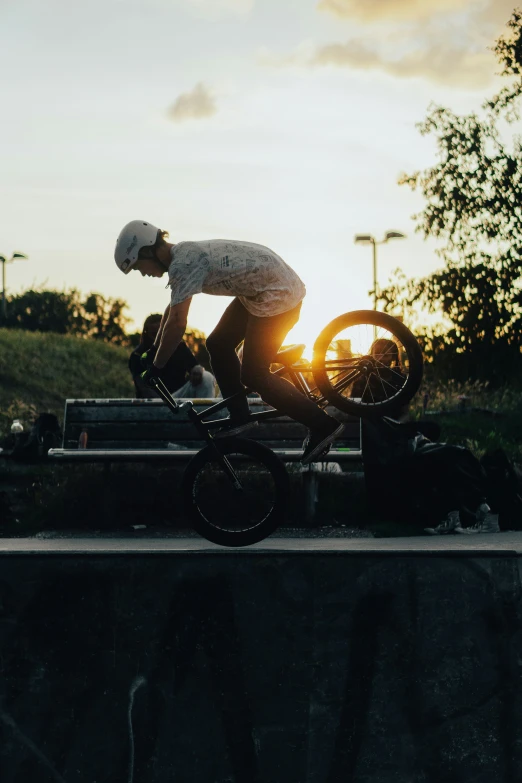 a guy on a bicycle on a rail