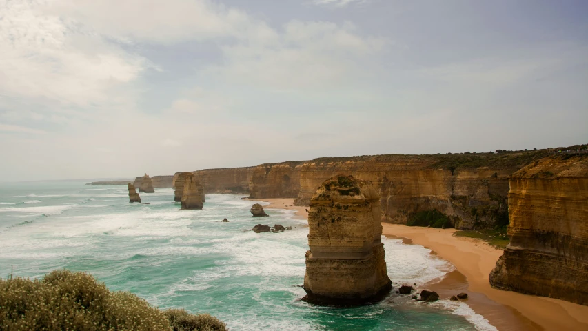 a view of a large cliff in the ocean