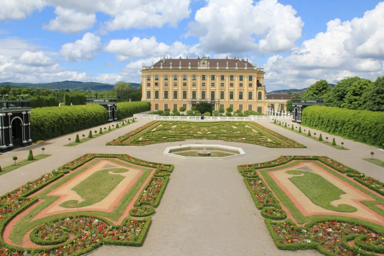 an elaborately set garden in front of a house