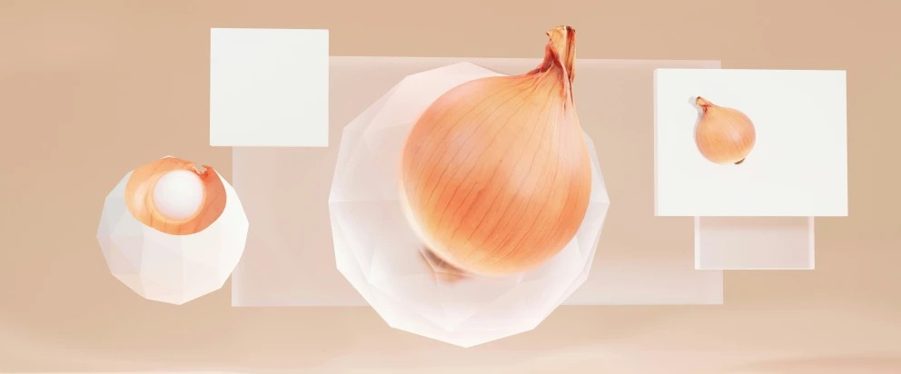 a onion on top of a white surface with geometric shapes