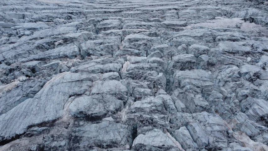 a large group of mountains sitting in the snow