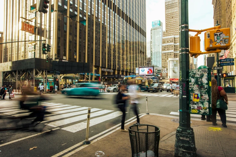 some people on a busy city street and cars