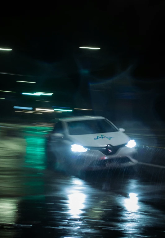 a car on a wet street at night