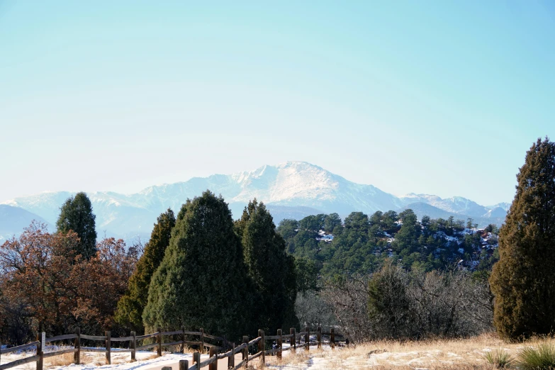 a snowy day with mountains in the background