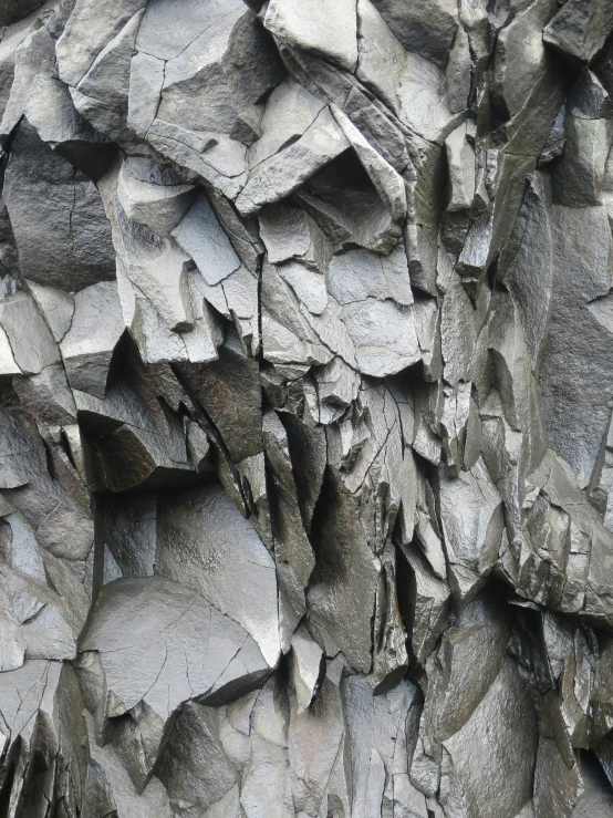 close up of rock formation with the large rocks behind it