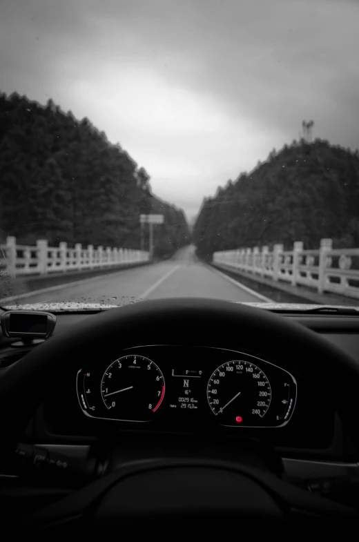 a car dashboard with cars lights and gauges