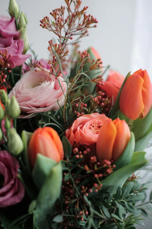 an arrangement of flowers sitting in a vase