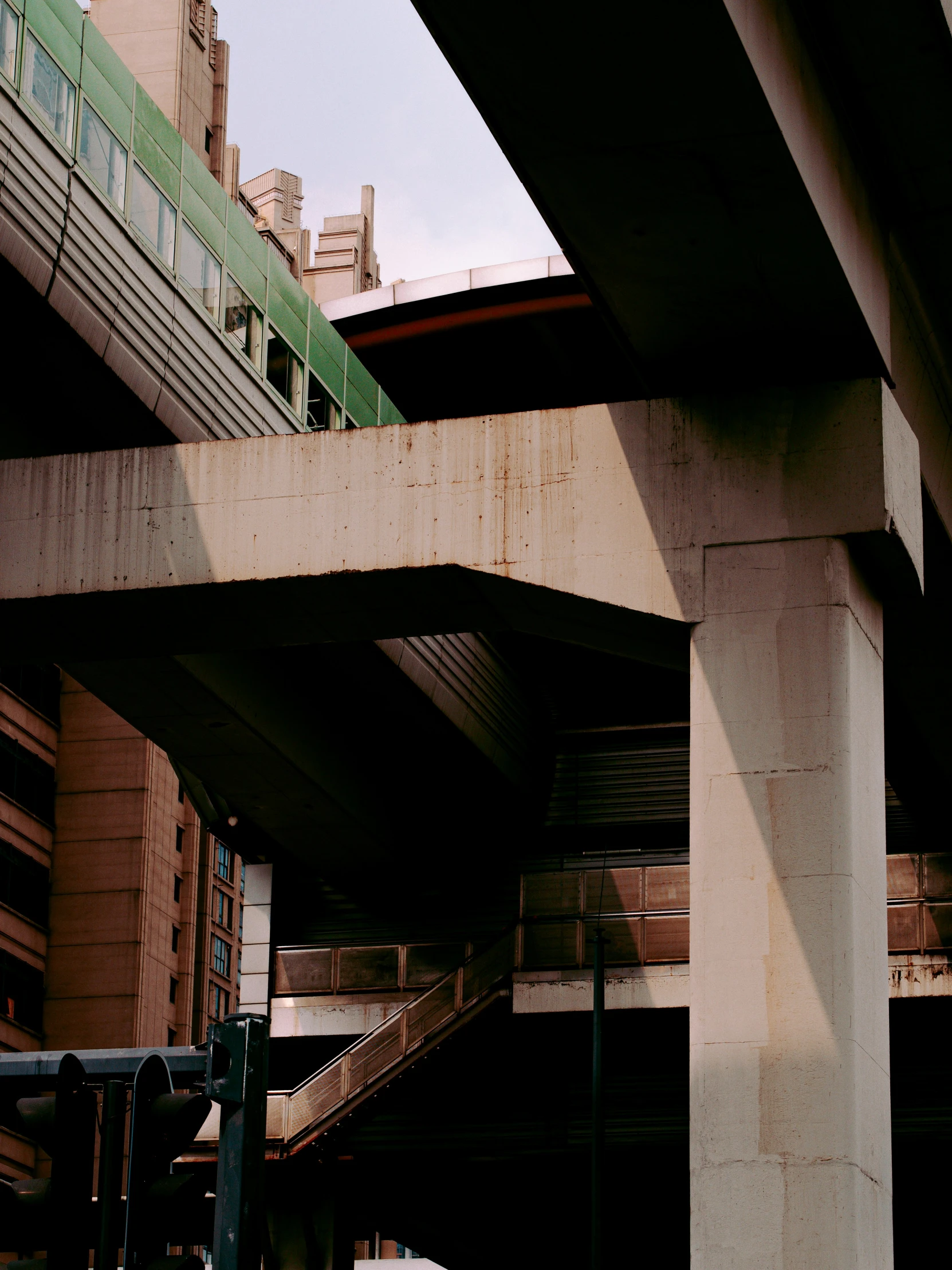 a picture under an overpass with a green roof