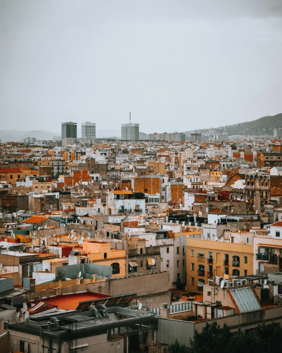 an overcast day in the city with orange buildings