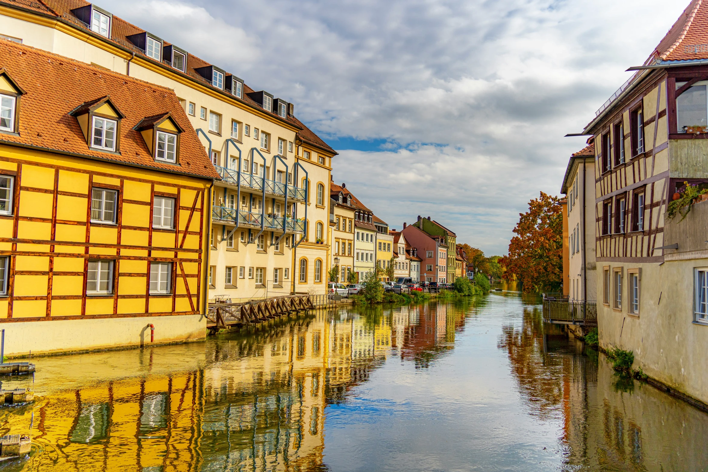 a group of buildings sit along the water