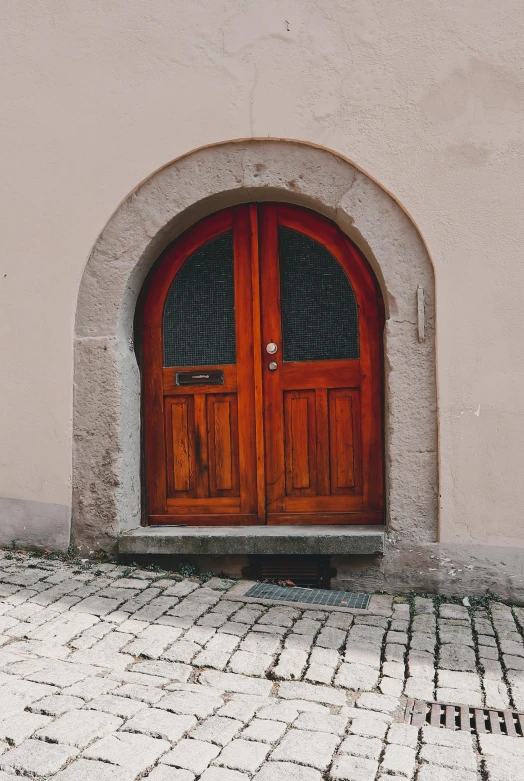 there is a red door that has some glass on it