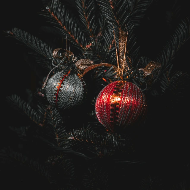 a red ball on top of some pine trees