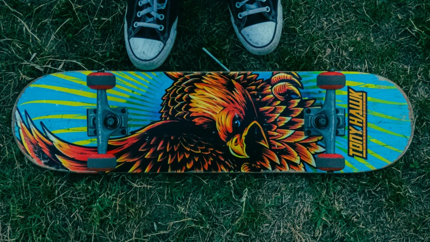 a painted skateboard with a picture of an eagle on the front