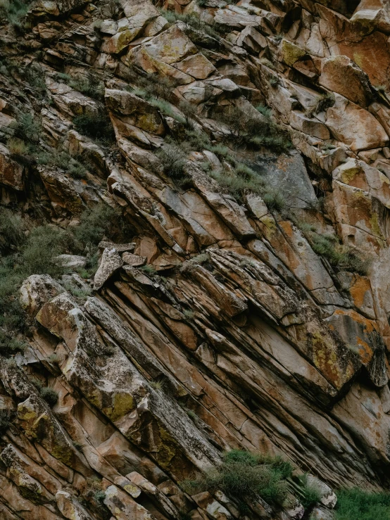 some rock that is next to some grass