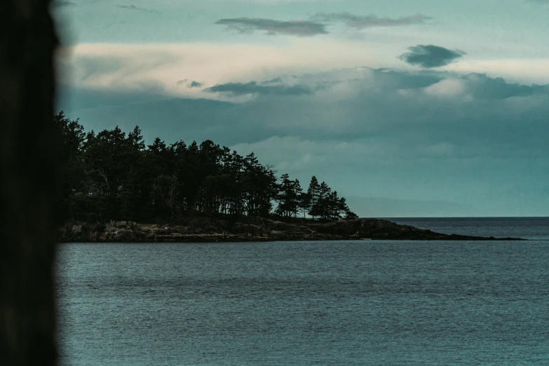 the small island sits in the middle of the sea