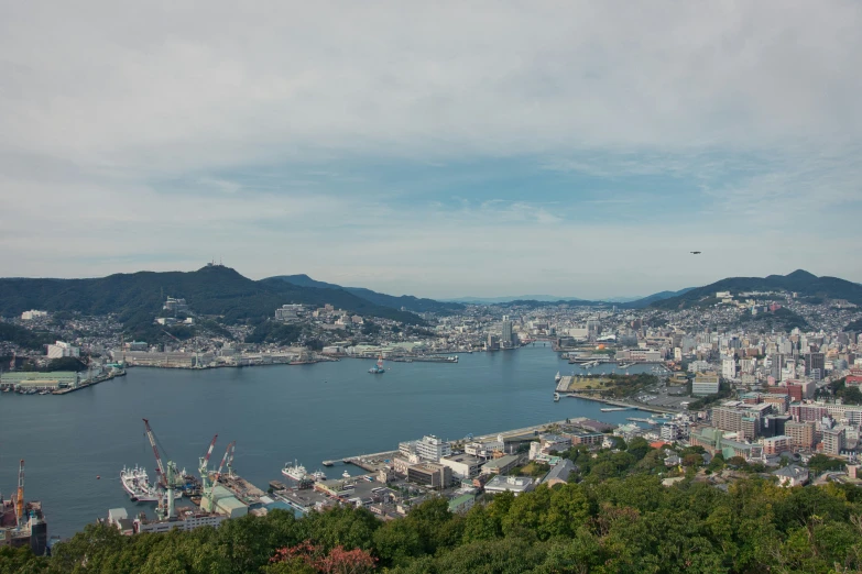 the city is surrounded by large bay, mountain and a lake