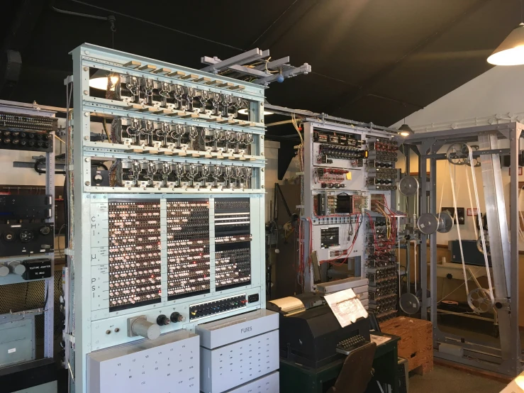 a room with various electrical equipment and large mirrors