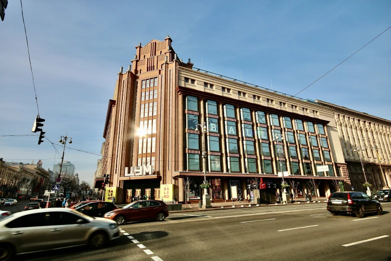 large building near busy city with cars driving by