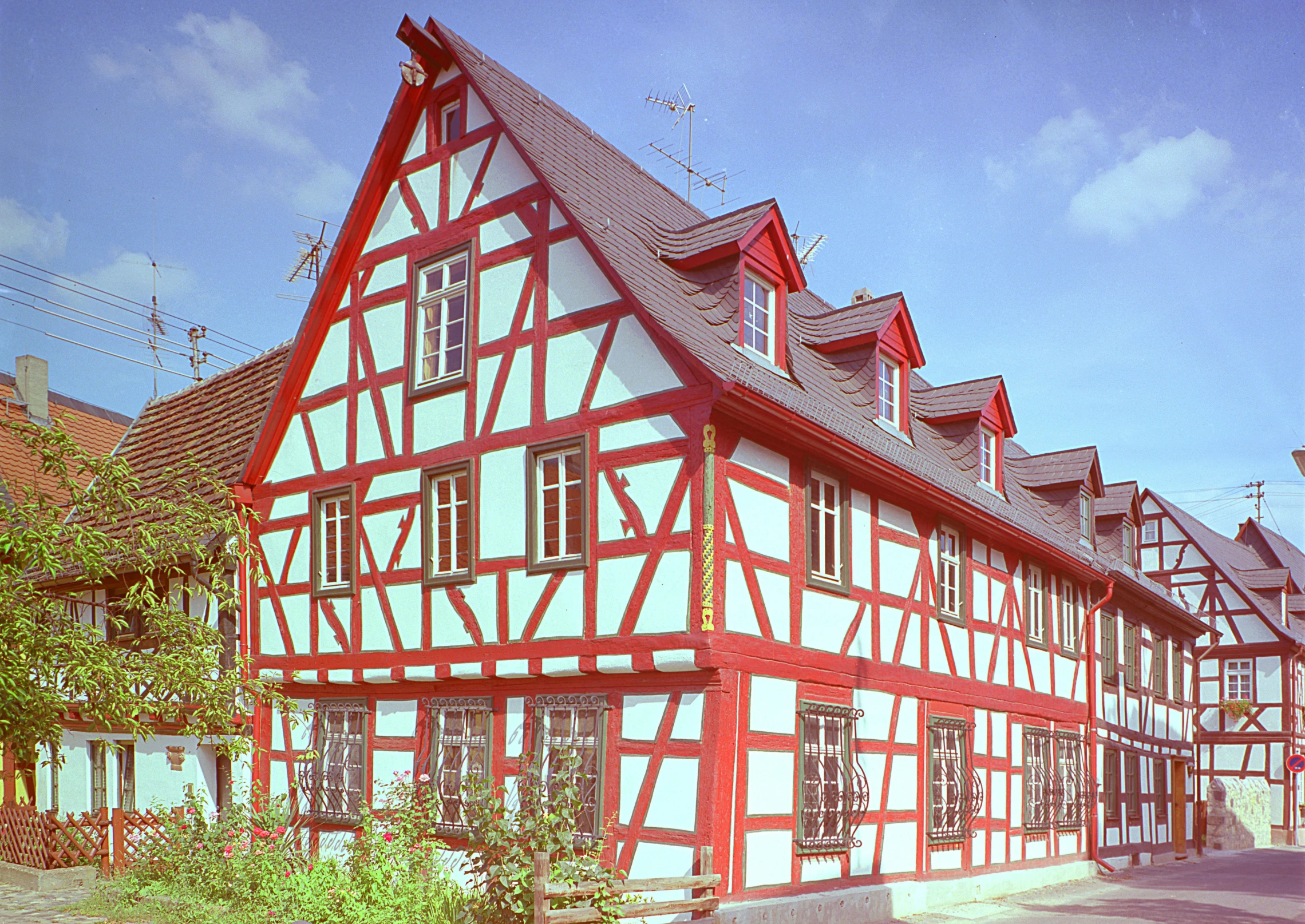 red and white building with windows and balconies