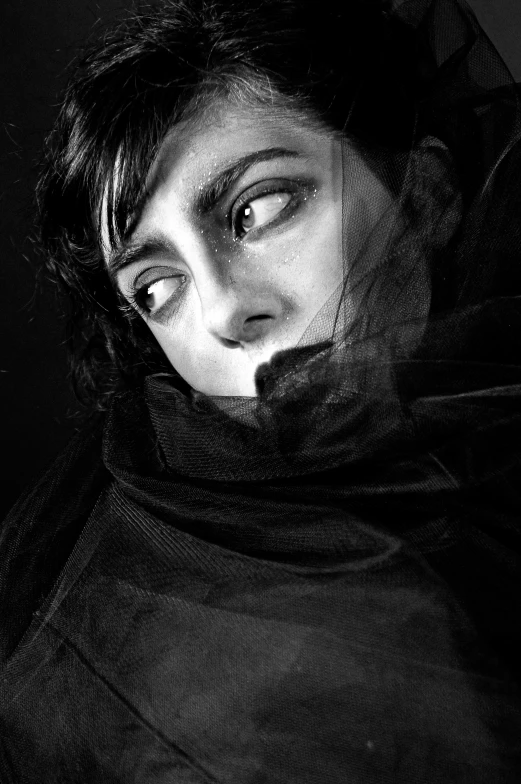 black and white pograph of a woman with eyes open