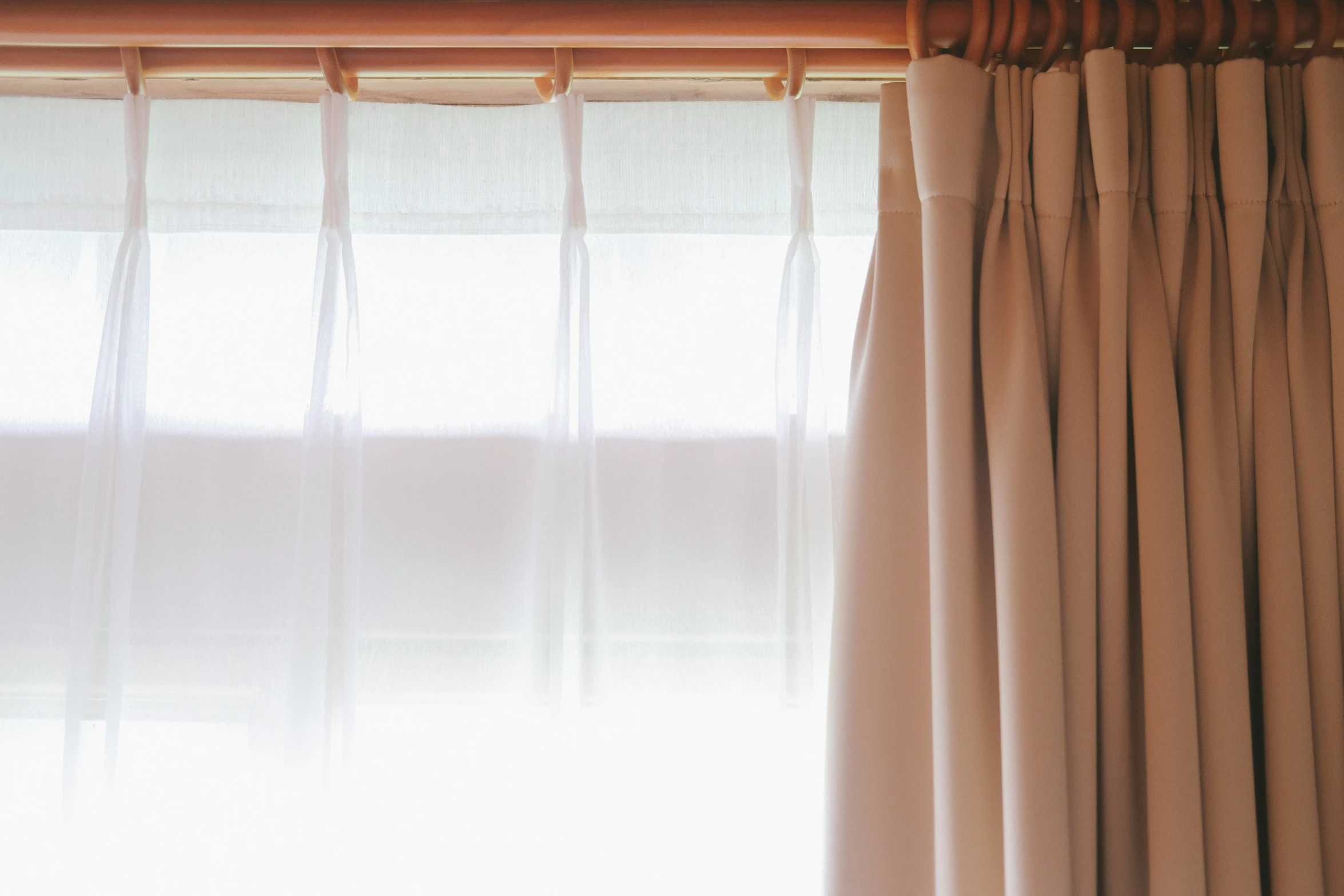 a close up of a window with curtains