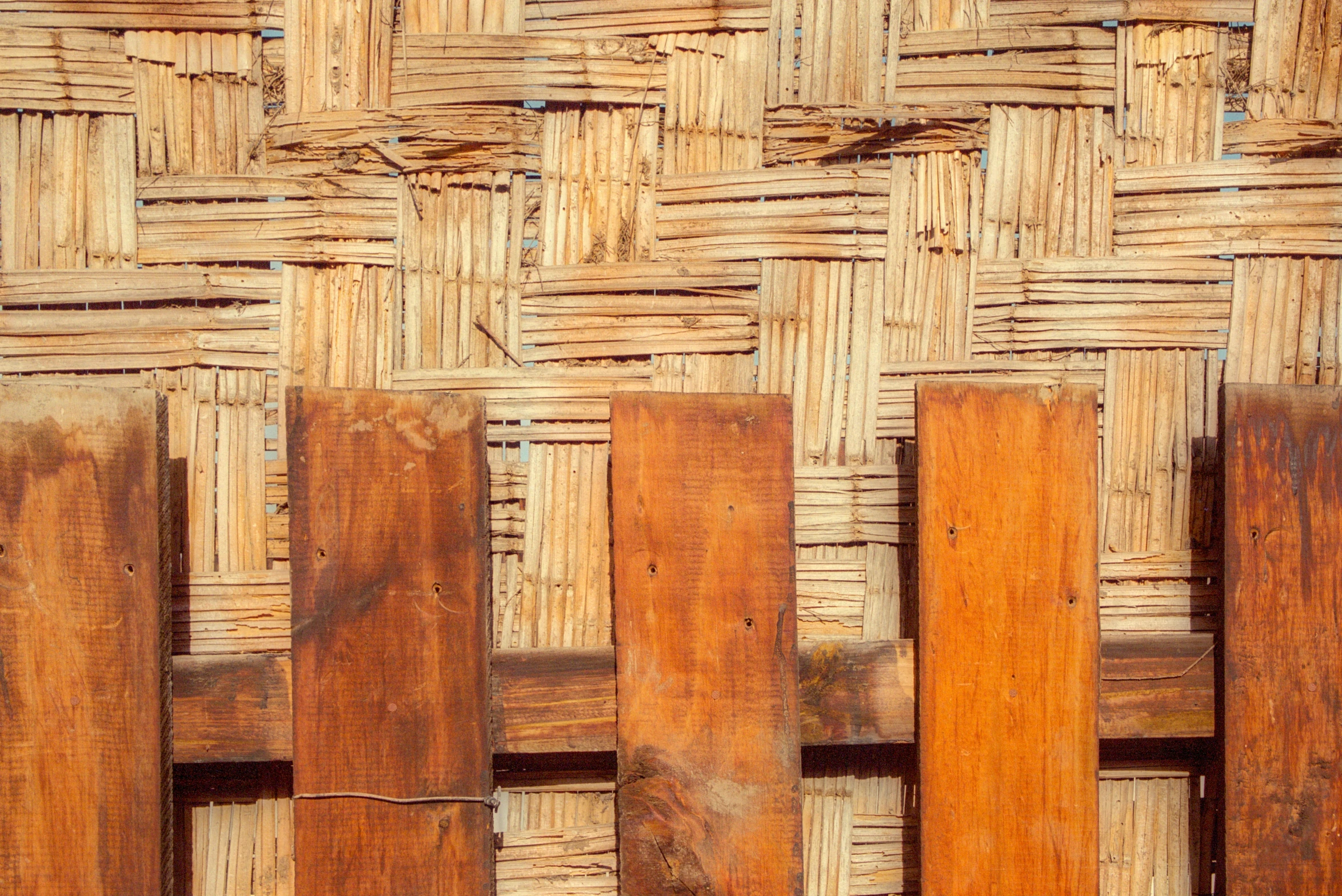 a wood door with wooden boards behind it