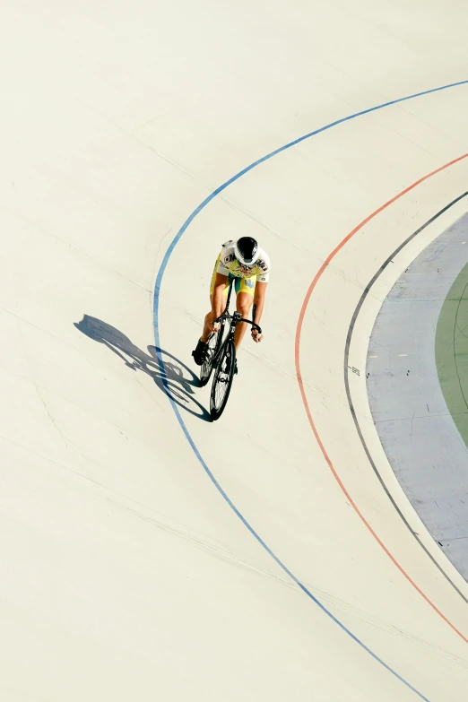 the cyclist is riding through some curving concrete