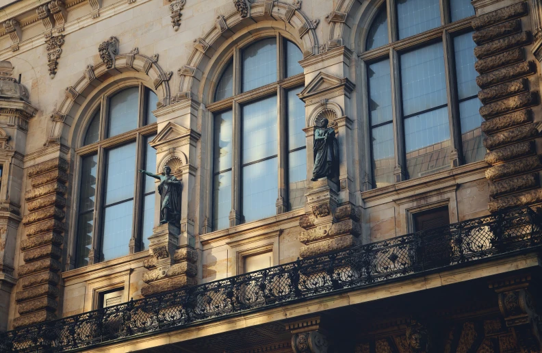 this is the outside side of a building that has ornate windows and balconies