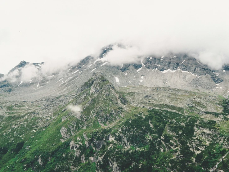 aerial view of mountains with clouds in the sky