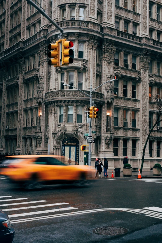 this is a blurry picture of a car approaching a building