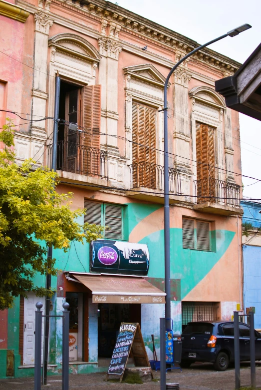 a car parked in front of an old building