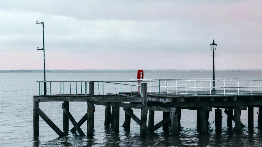 an ocean view with a pier and a life preserver