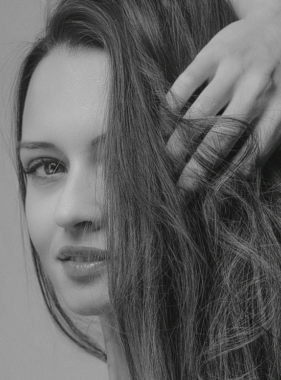 black and white pograph of woman with wavy hair